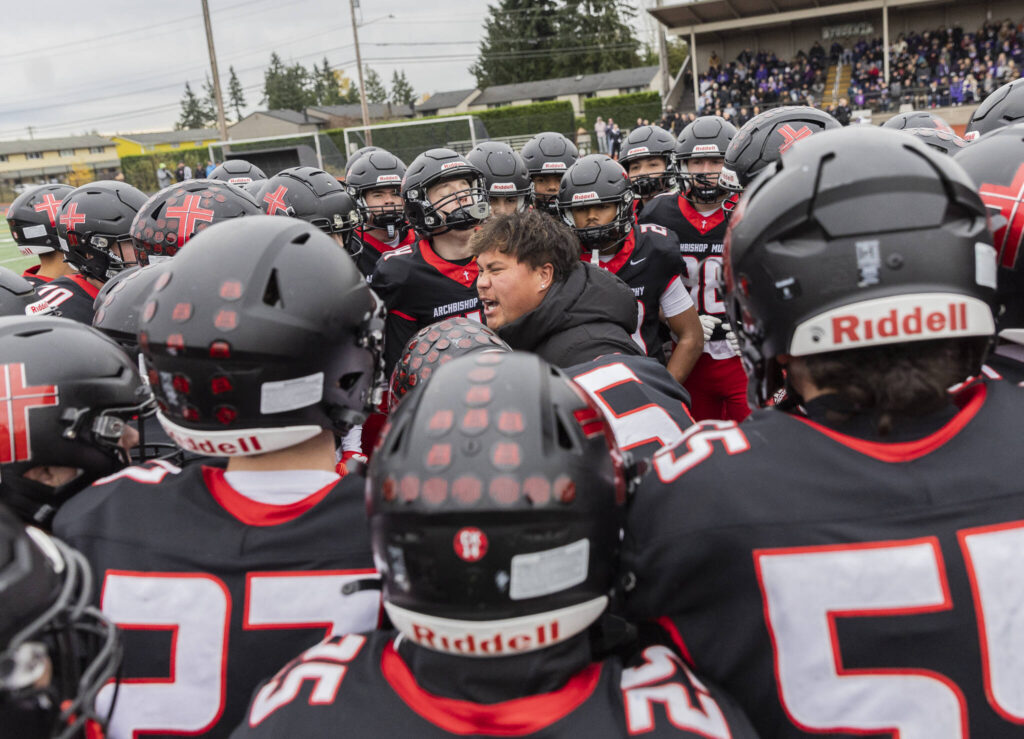 Archbishop Murphy players cheer before the 2A state football semifinal game against Anacortes on Nov. 29, 2025 in Everett, Washington. (Olivia Vanni / The Herald)
