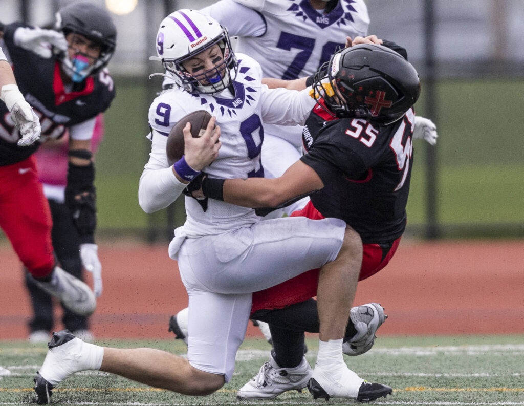 Archbishop Murphy’s Tayden Olson sacks Anacortes’ Ryan Harrington during the 2A state football semifinal game on Nov. 29, 2025 in Everett, Washington. (Olivia Vanni / The Herald)
