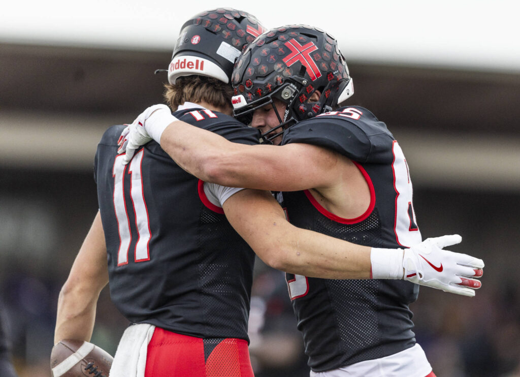 Archbishop Murphy’s Henry Gabalis celebrates his touchdown with teammates Jack Sievers during the 2A state football semifinal game against Anacortes on Nov. 29, 2025 in Everett, Washington. (Olivia Vanni / The Herald)

