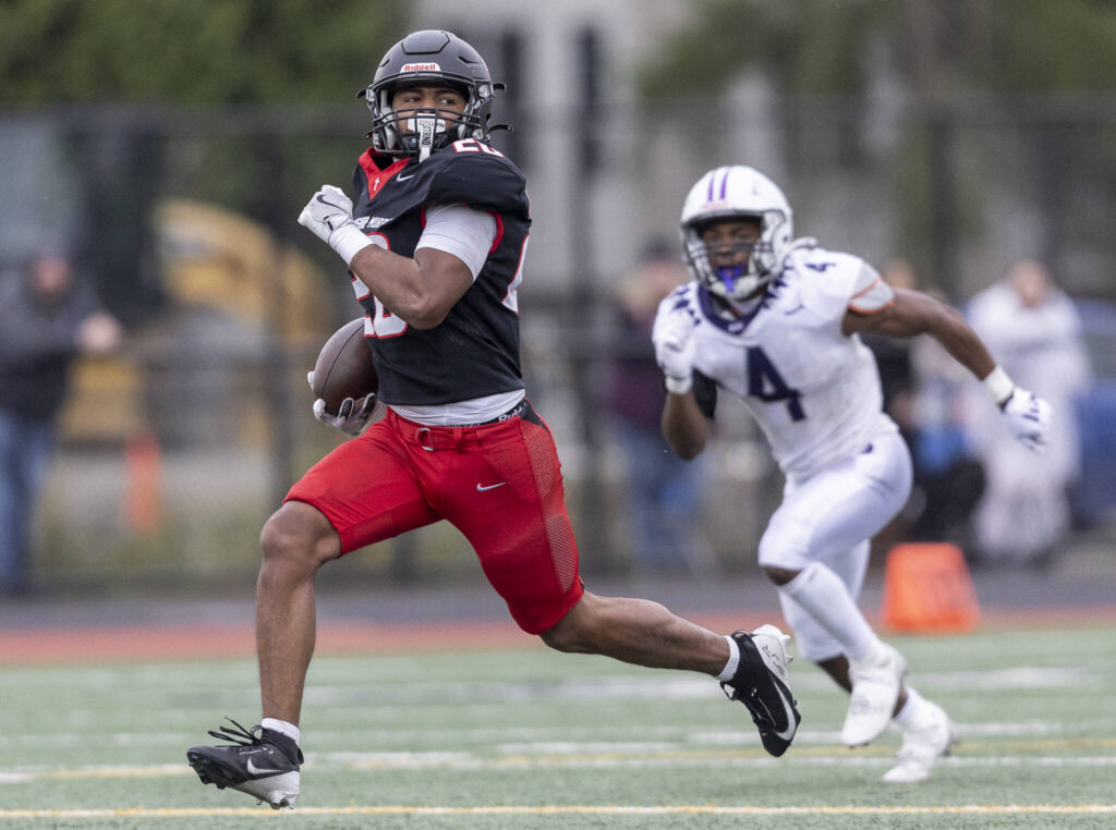 Archbishop Murphy’s Isaiah Smith runs the ball upfield to the end zone for a touchdown during the 2A state football semifinal game against Anacortes on Nov. 29, 2025 in Everett, Washington. (Olivia Vanni / The Herald)
