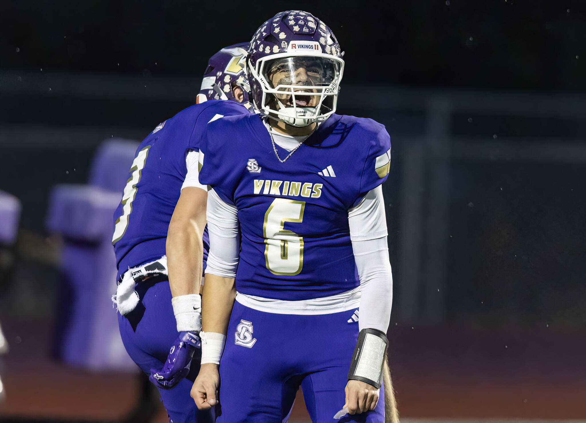 Lake Stevens’ Blake Moser yells after scoring a touchdown during the 4A state football quarterfinal game against Moses Lake on Nov. 22, 2025 in Lake Stevens, Washington. (Olivia Vanni / The Herald)