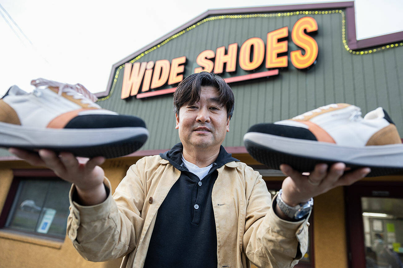 Wide Shoes owner Dominic Ahn outside of his store along 205th Street on Nov. 20, 2025 in Edmonds, Washington. (Olivia Vanni / The Herald)