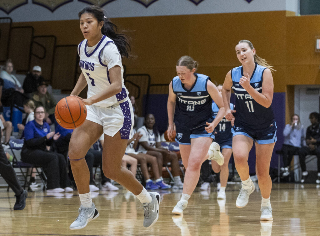 Lake Stevens’ Noelani Tupua steals the ball an dribbles up the court for a layup against Tenison Woods on Dec. 2, 2025 in Lake Stevens, Washington. (Olivia Vanni / The Herald)
