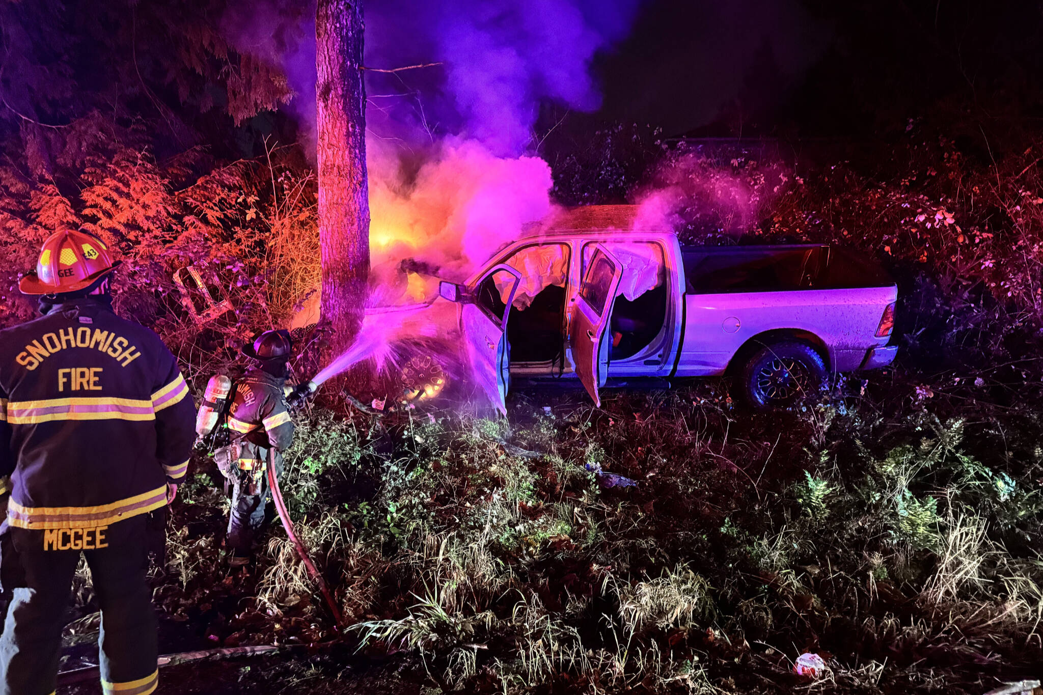 Snohomish County Fire District No. 4 firefighters extinguish a fire that began after a truck collided with a tree on Dec. 3, 2025, in Snohomish, Washington. (Snohomish County Fire District No. 4)