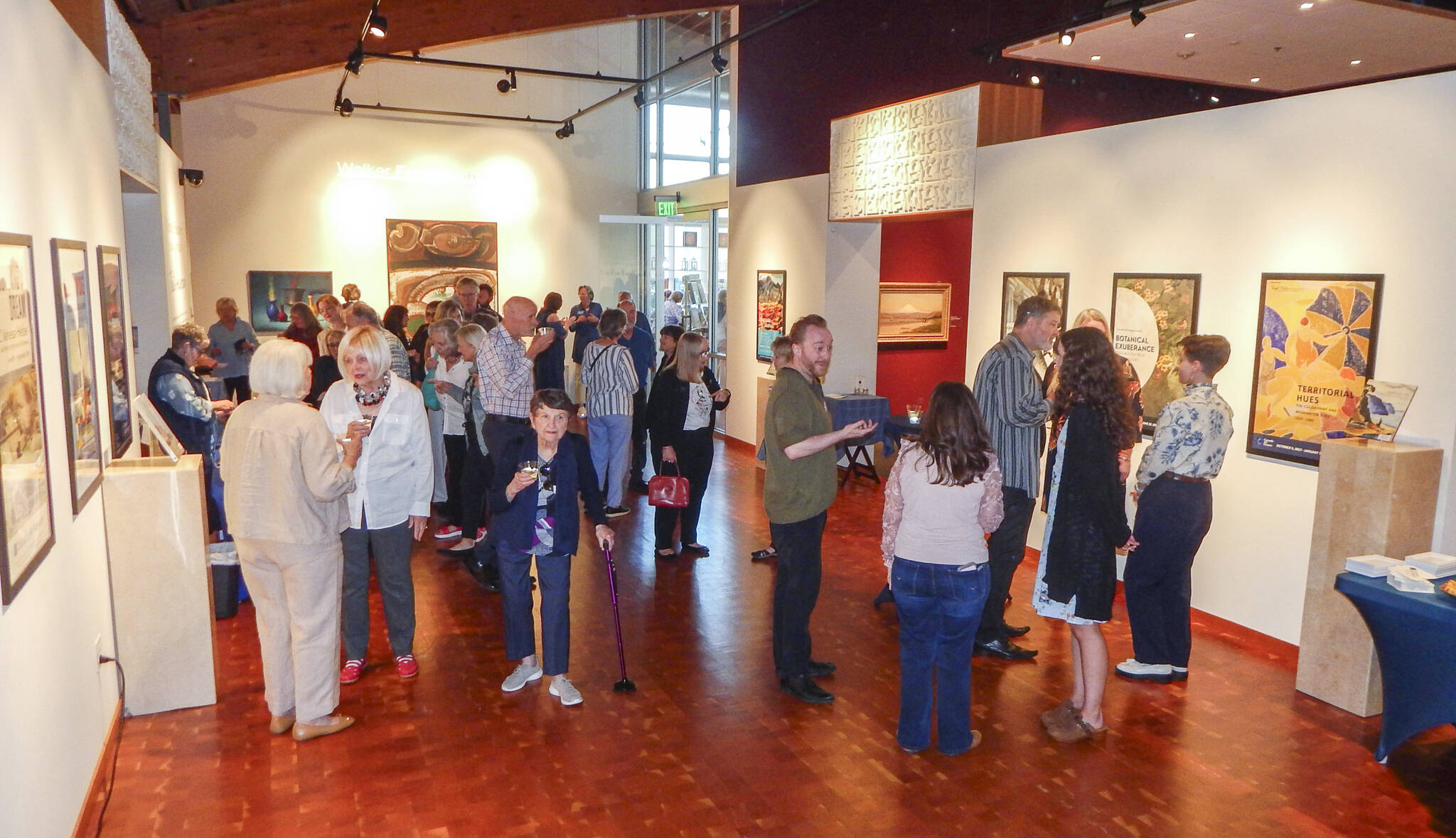 Cascadia visitors mingle among the art during its 10th anniversary celebration, on Sept. 12, in Edmonds, Wash. (Jon Bauer / The Herald)