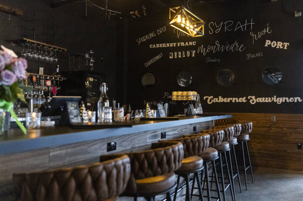 The bar counter inside the Rustic Cork Wine Bar at the Port of Everett on Dec. 2, 2025 in Everett, Washington. (Olivia Vanni / The Herald)
