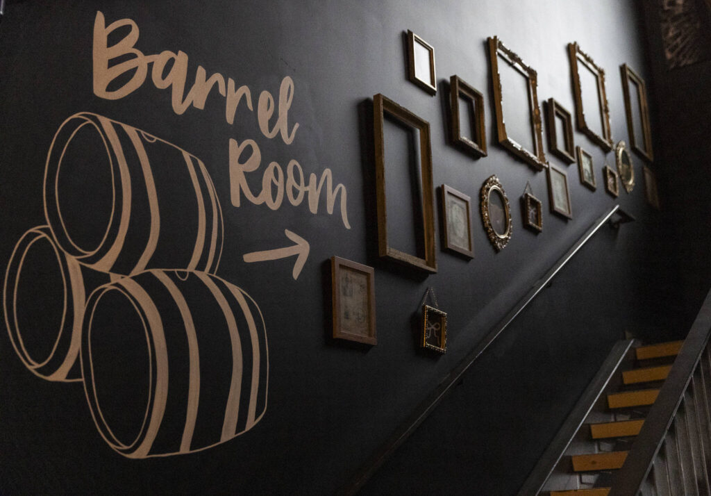 Stairs leading up to the “Barrel Room” and second story room and deck at the Rustic Cork Wine Bar on Dec. 2, 2025 in Everett, Washington. (Olivia Vanni / The Herald)
