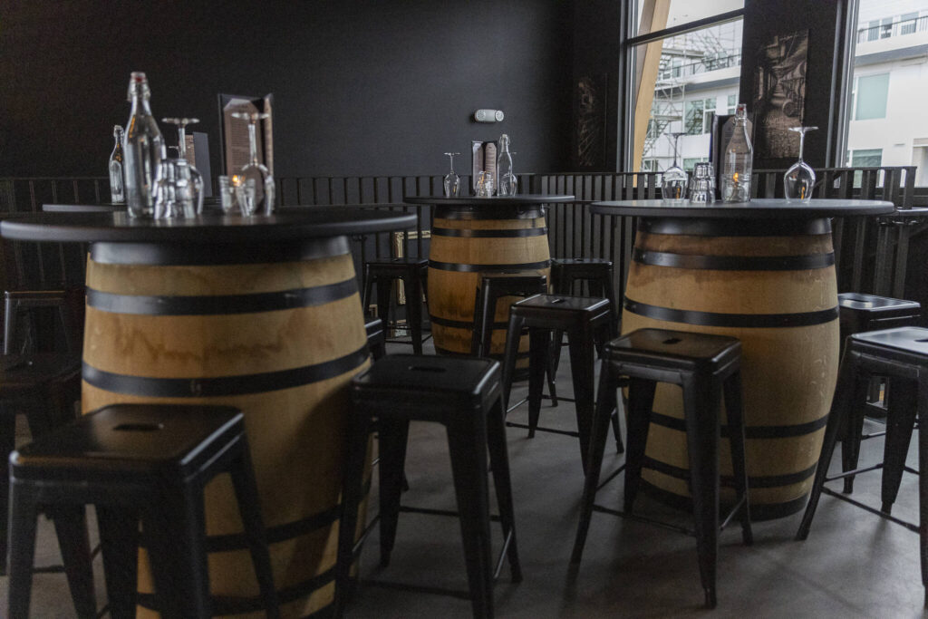 Bar tables in the Barrel Room of the Rustic Cork Wine Bar on Dec. 2, 2025 in Everett, Washington. (Olivia Vanni / The Herald)
