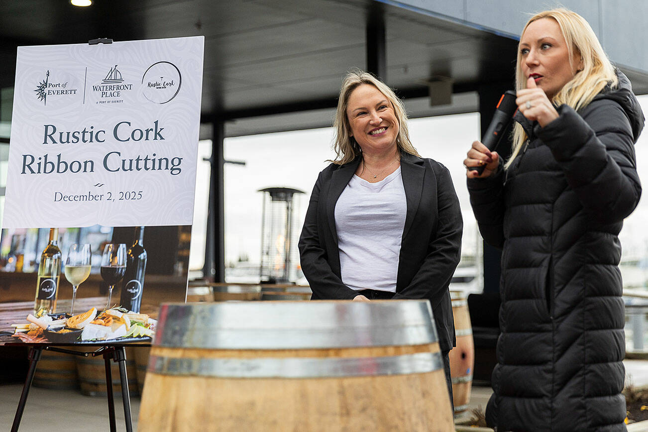 Kelsey Olson, the owner of the Rustic Cork Wine Bar, is introduced by Port of Everett Executive Director Lisa Lefebar on Dec. 2, 2025 in Everett, Washington. (Olivia Vanni / The Herald)