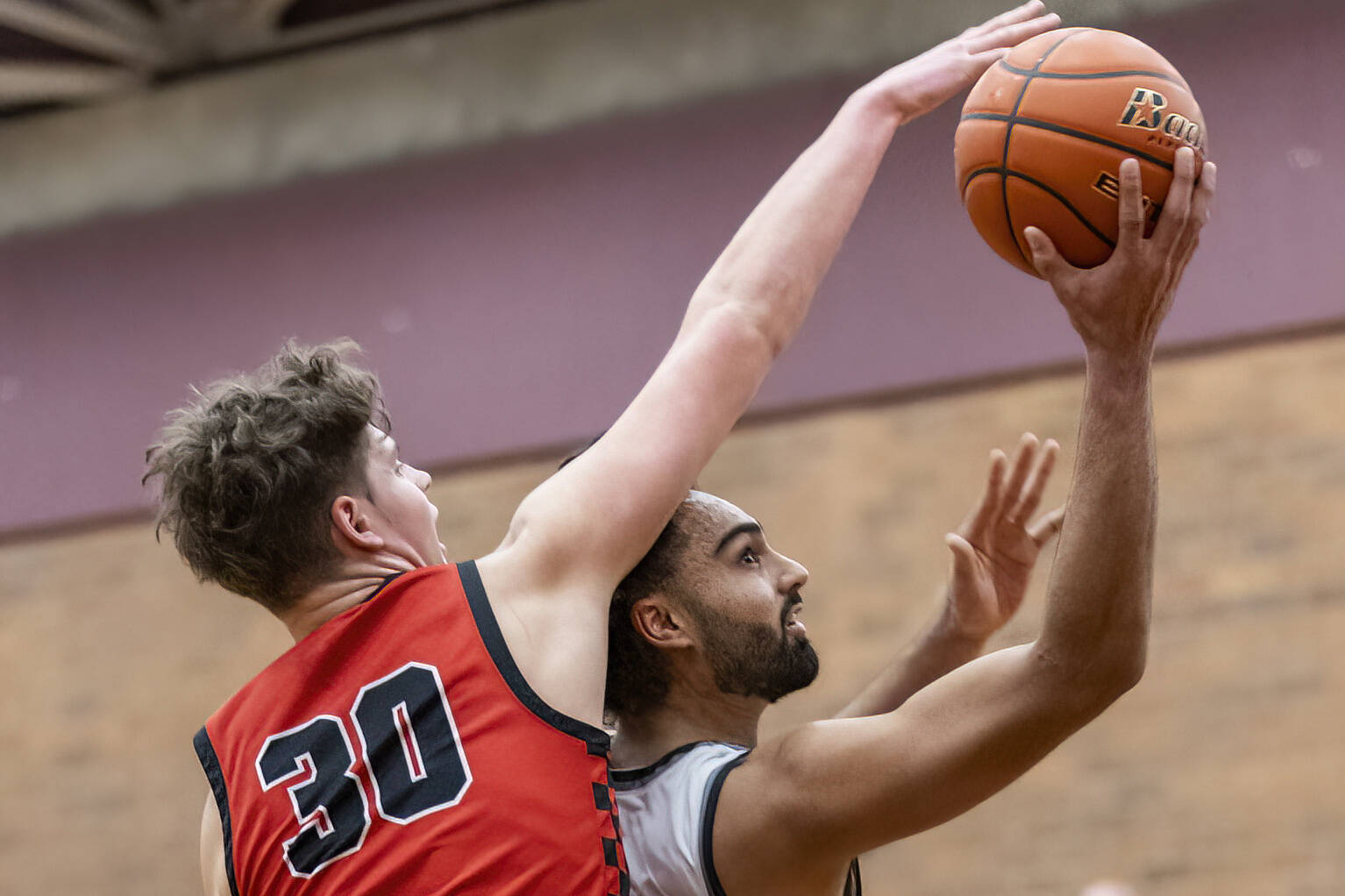 Snohomish’s Deyton Wheat blocks a shot by Mountlake Terrace’s Svayjeet Singh during the 3A district loser-out playoff game on Thursday, Feb. 13, 2025 in Mountlake Terrace, Washington. (Olivia Vanni / The Herald)