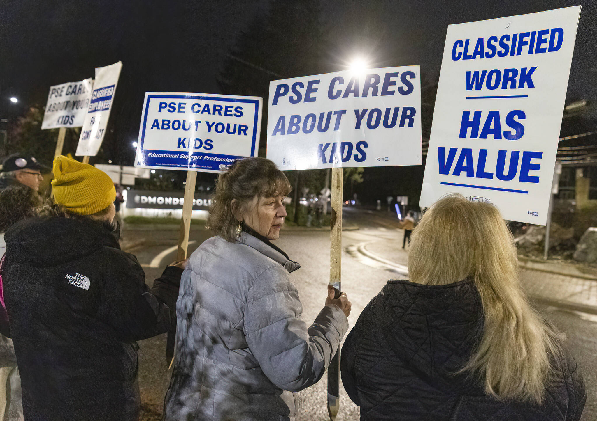 Diane Grossenbacher, an office manager at Lynndale Elementary School, rallies outside of the Edmonds School District building before a meeting to push the district for a contract on Tuesday, Dec. 9, 2025, in Edmonds, Washington. (Olivia Vanni / The Herald)