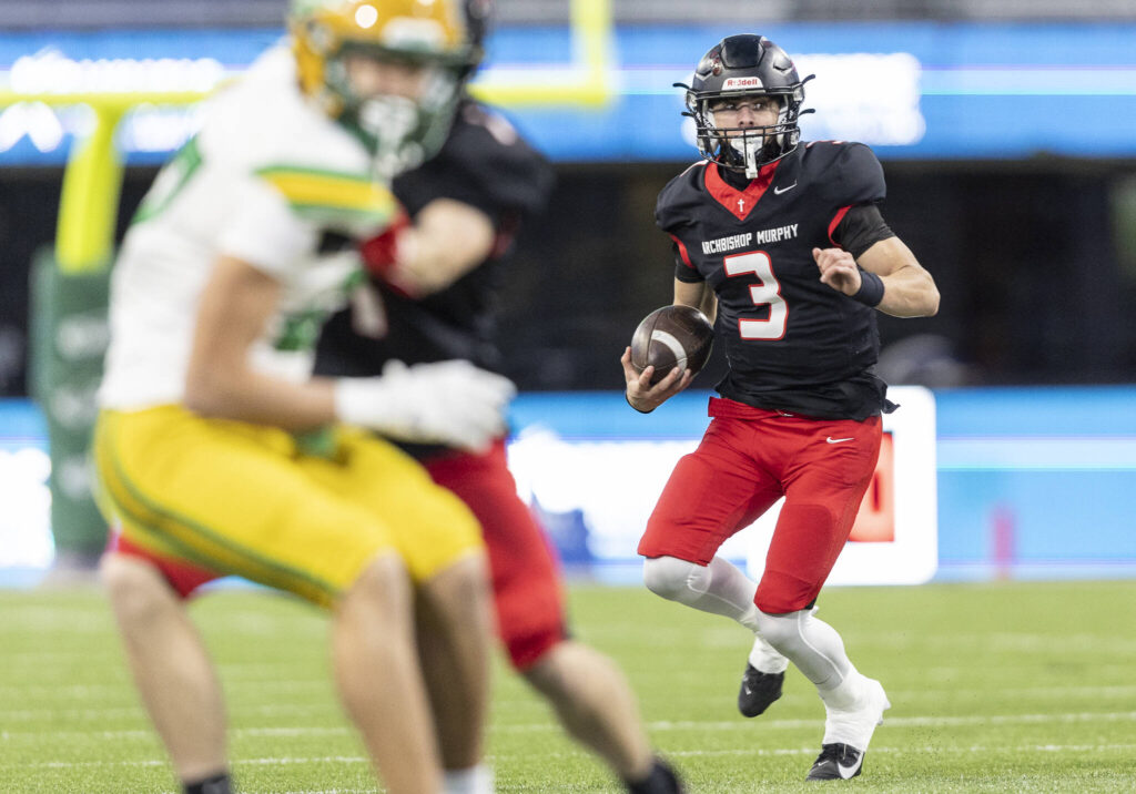 Archbishop Murphy&rsquo;s Evan Ruiz runs with the ball during the 2A state championship game against Tumwater at Husky Stadium on Saturday, Dec. 6, 2025 in Seattle, Washington. (Olivia Vanni / The Herald)
