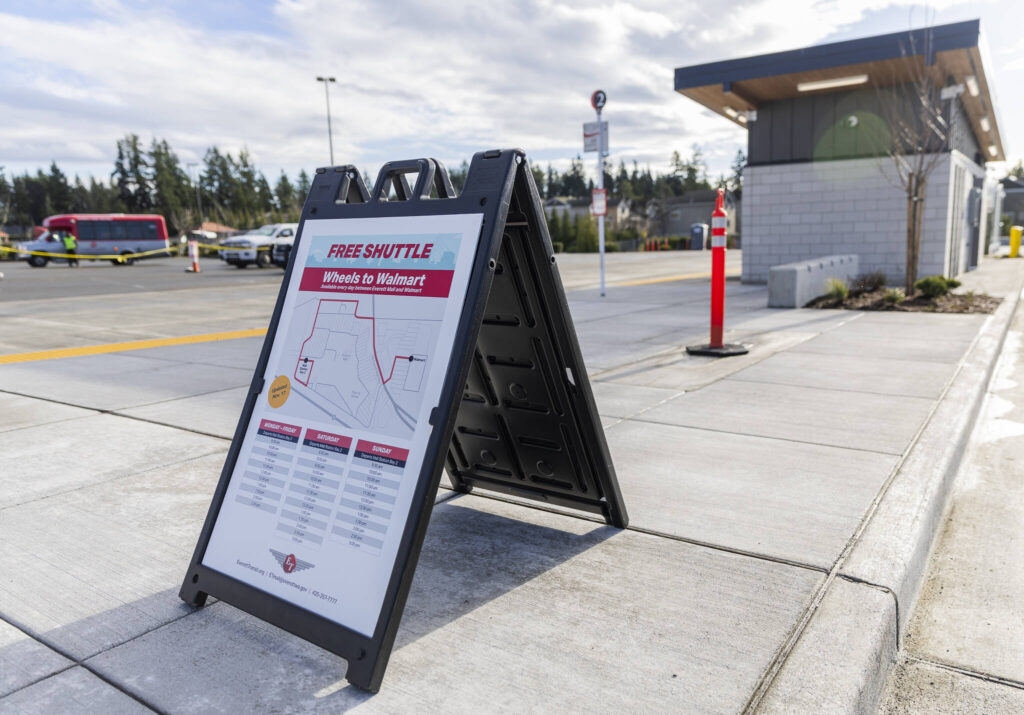 A sign at Everett Transit&rsquo;s Mall Station advertises free shuttles to Walmart on Monday, Dec. 22, 2025, in Everett, Washington. (Olivia Vanni / The Herald)
