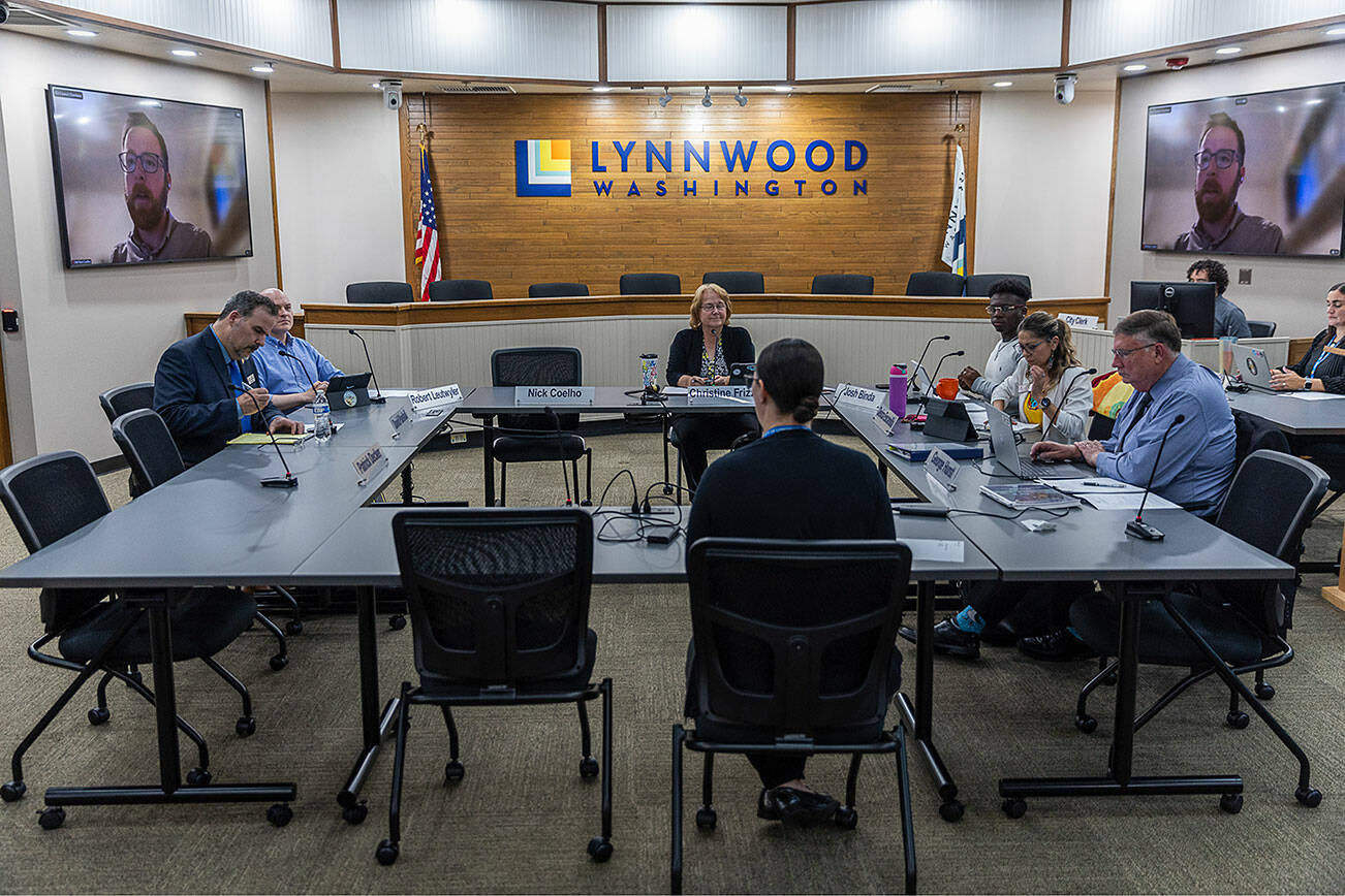 The Lynnwood City Council listens to a presentation by Finance Director Michelle Meyer during a city council meeting on on Monday, Sept. 15, 2025 in Lynnwood, Washington. (Olivia Vanni / The Herald)