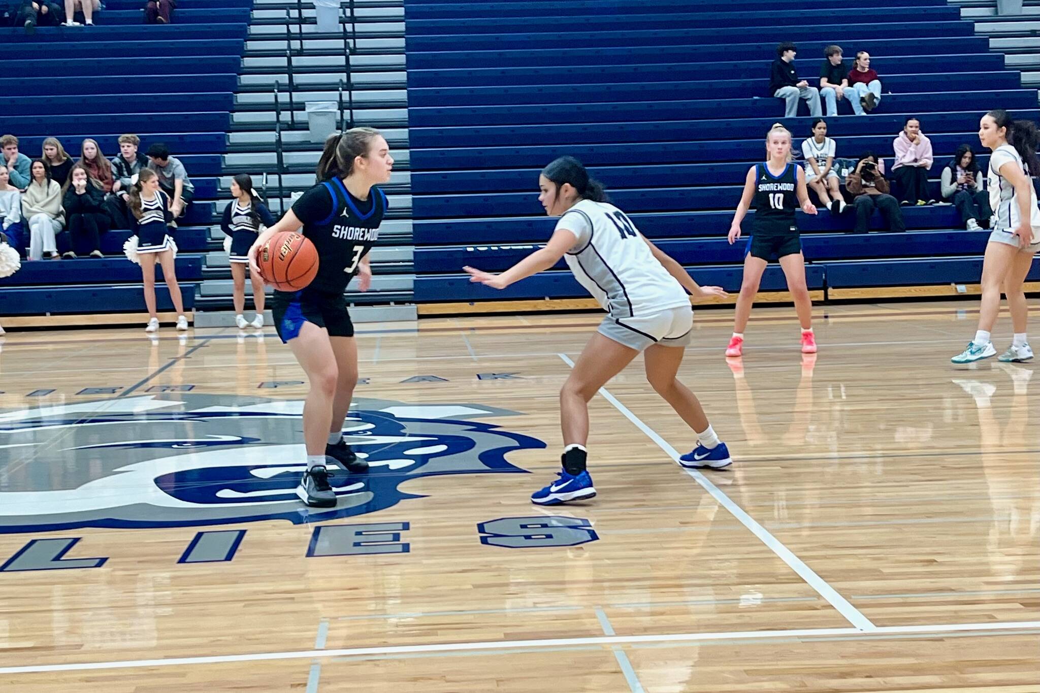 Glacier Peak freshman Aliyah Jazmin (right) positions herself in front of Shorewood junior Karmin Kasberg during the Grizzlies' 77-46 win against the Stormrays at Glacier Peak High School on Dec. 9, 2025. (Joe Pohoryles / The Herald)