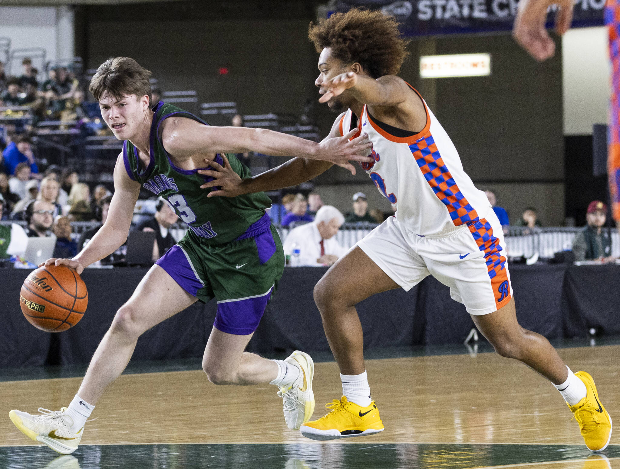 Edmonds-Woodways DJ Karl takes the ball down the court during the 3A boys championship game against Rainier Beach on Saturday, March 8, 2025 in Tacoma, Washington. (Olivia Vanni / The Herald)