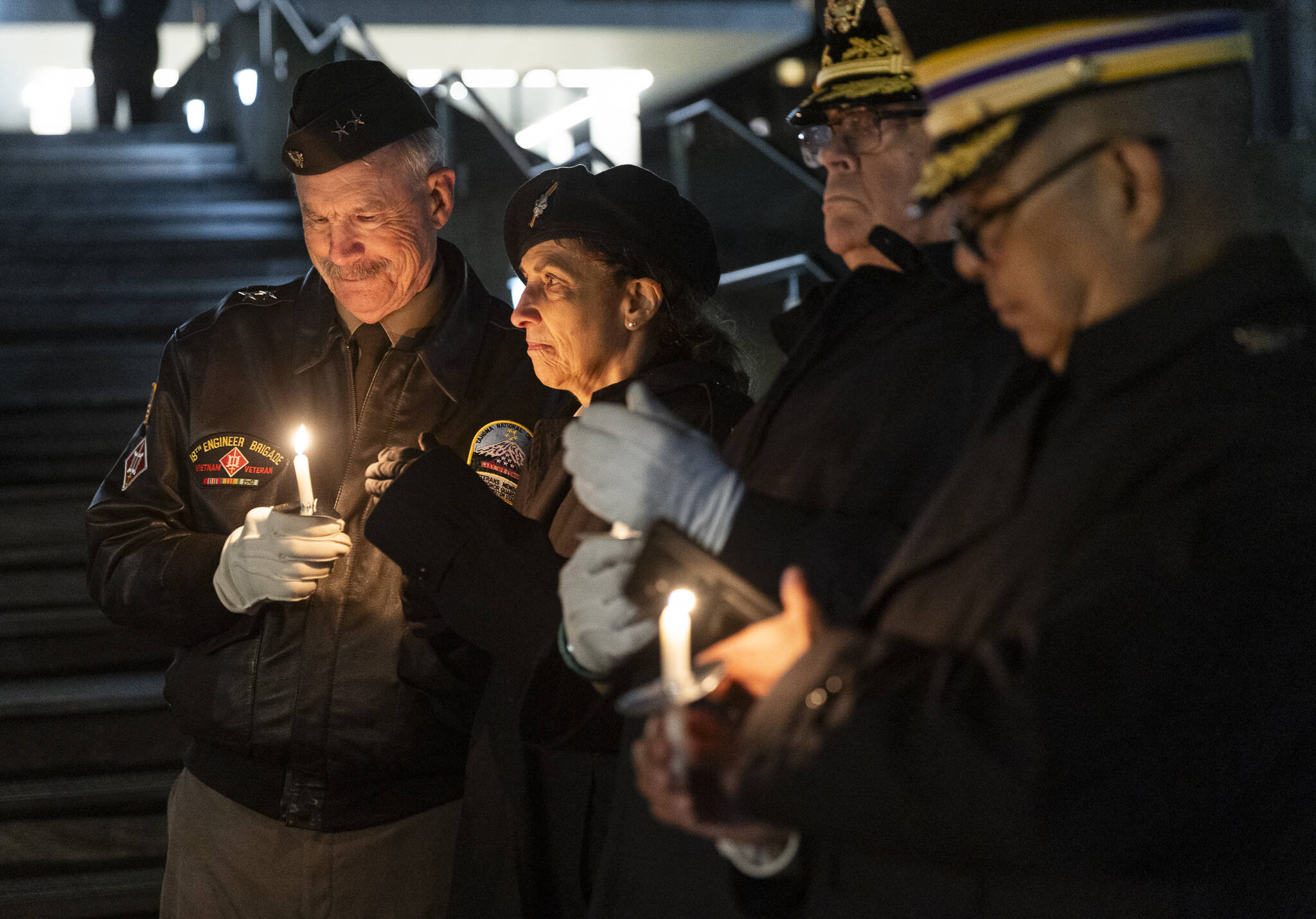 Veteran Tim Miller along with other members of the United States Volunteers-Joint Services Command hold a candles at a vigil outside the Snohomish County Courthouse in remembrance of deaths this year within the areas homeless population on Friday, Dec. 19, 2025 in Everett, Washington. (Olivia Vanni / The Herald)