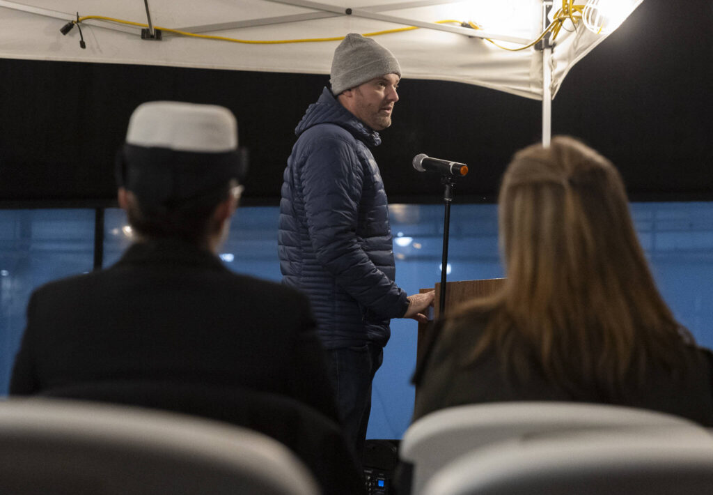 Travis Gannon, founder of One Day at a Time, speaks at Snohomish County&rsquo;s Veterans Homelessness Committee&rsquo;s annual Homeless Memorial Vigil on Friday, Dec. 19, 2025 in Everett, Washington. (Olivia Vanni / The Herald)
