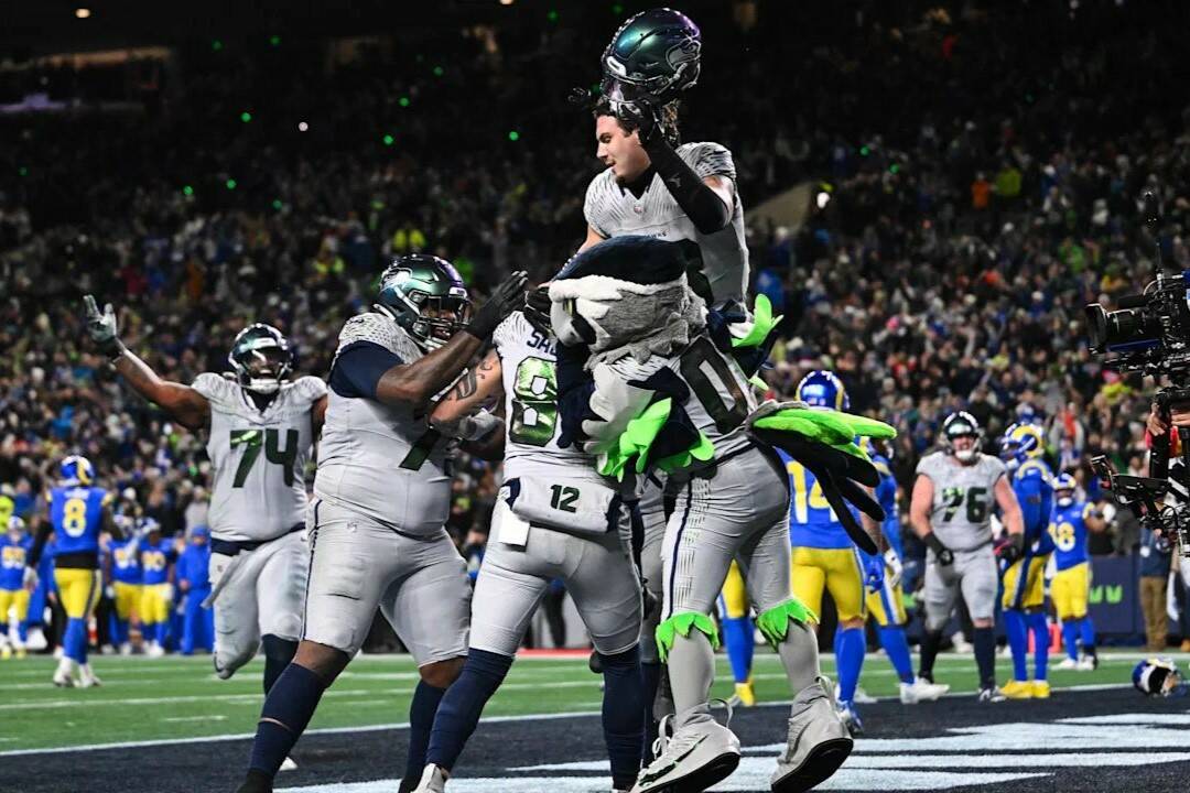 Seattle Seahawks tight end Eric Saubert is lifted up by his teammates after scoring the game-winning 2-point conversion against the Los Angeles Rams on Thursday, Dec. 18, 2025 at Lumen Field in Seattle, Washington. (Photo courtesy of the Seattle Seahawks)