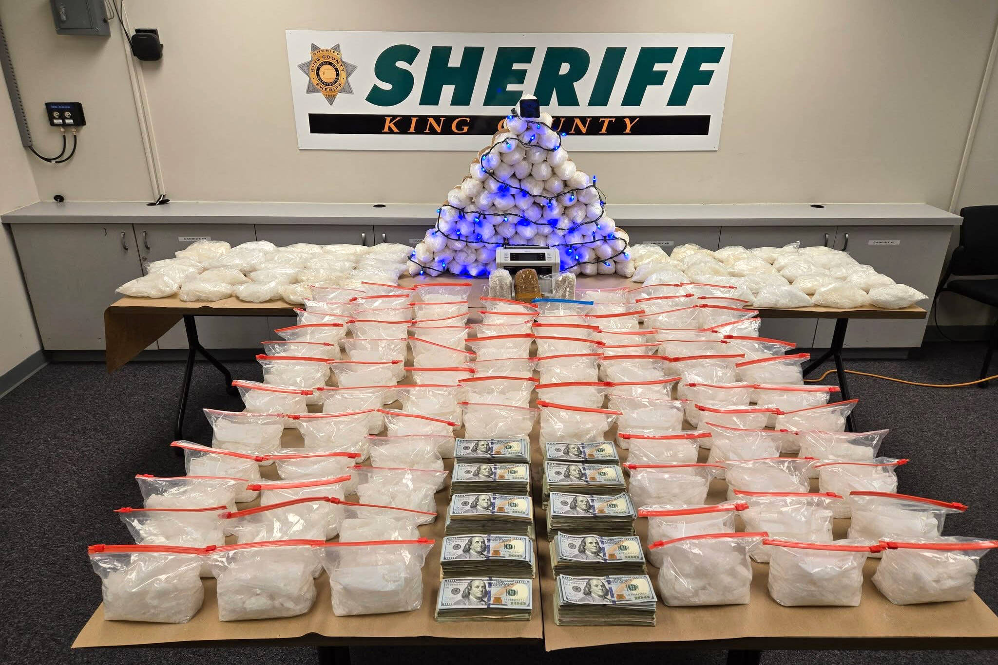 An investigation that the sheriffs office called the last chapter of Operation Eastbound and Down resulted in numerous bags of methamphetamine and cash taken to the King County Sheriffs Office in Seattle, Washington. (King County Sheriffs Office)