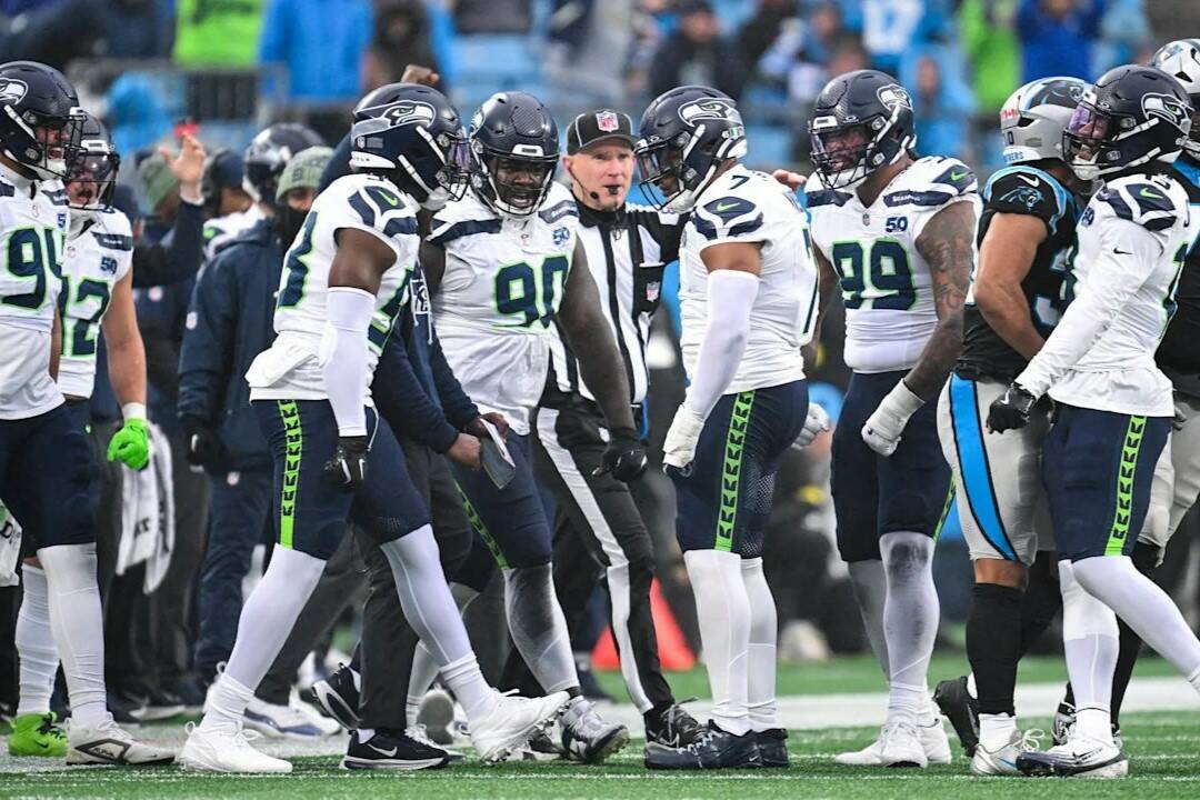 The Seattle Seahawks defense gathers after a stop against the Carolina Panthers on Sunday, Dec. 28, 2025 at Bank of America Stadium in Charlotte, North Carolina. (Photo courtesy of the Seattle Seahawks)