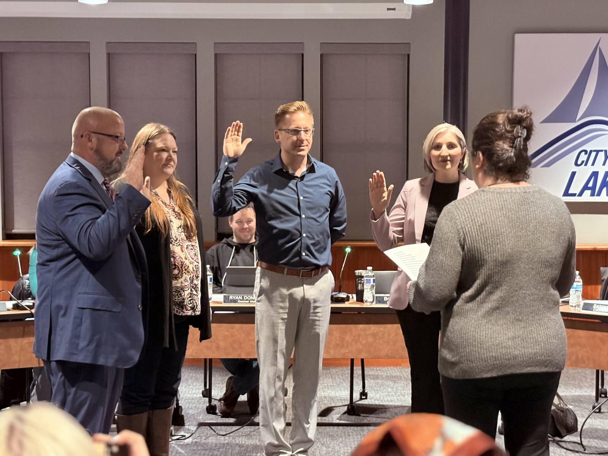 From left, newly elected Lake Stevens City Council members Brian McManus, Tosha Edwards, Nathan Packard and Sabina Araya are sworn on Tuesday, Jan. 6, 2025. (Taylor Scott Richmond / The Herald)