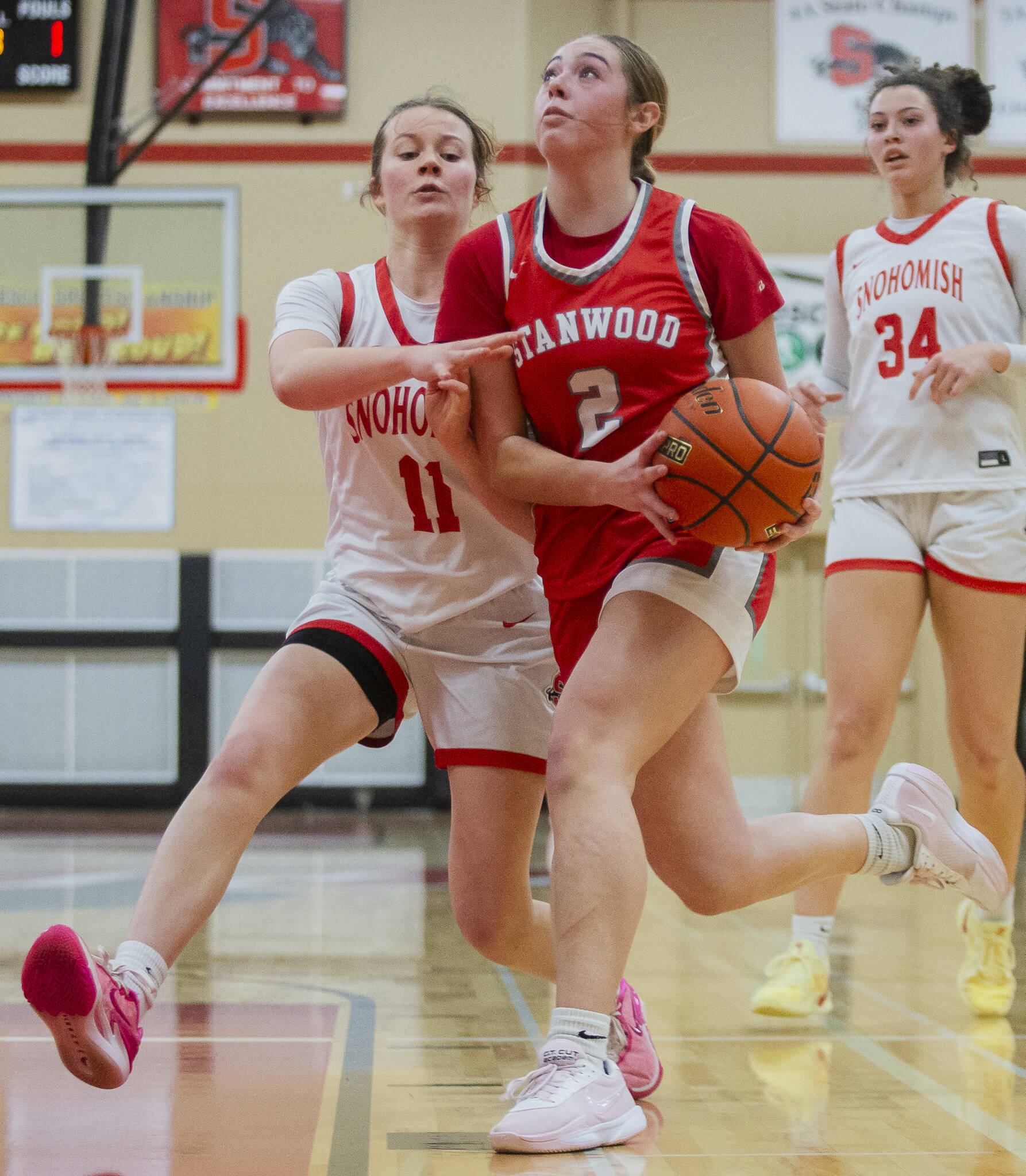 Stanwoods Ellalee Wortham tries to get around Snohomish’s Lizzie Allyn to make a shot during the game on Thursday, Jan. 9, 2025 in Snohomish, Washington. (Olivia Vanni / The Herald)
