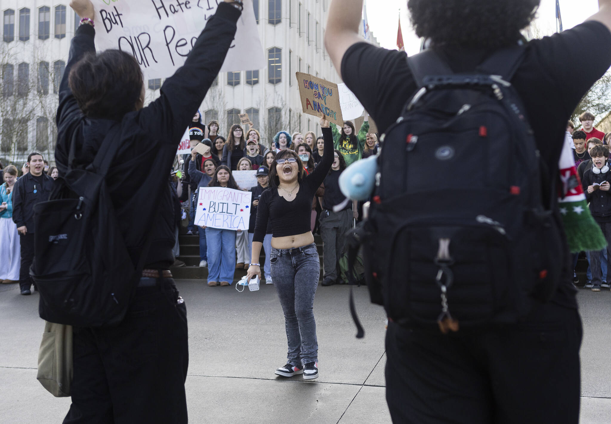Liliana P., a senior at Everett High School, speaks during a walkout rally in protest of ICE outside of the Snohomish County Courthouse on Tuesday, Jan. 13, 2026, in Everett, Washington. (Olivia Vanni / The Herald)