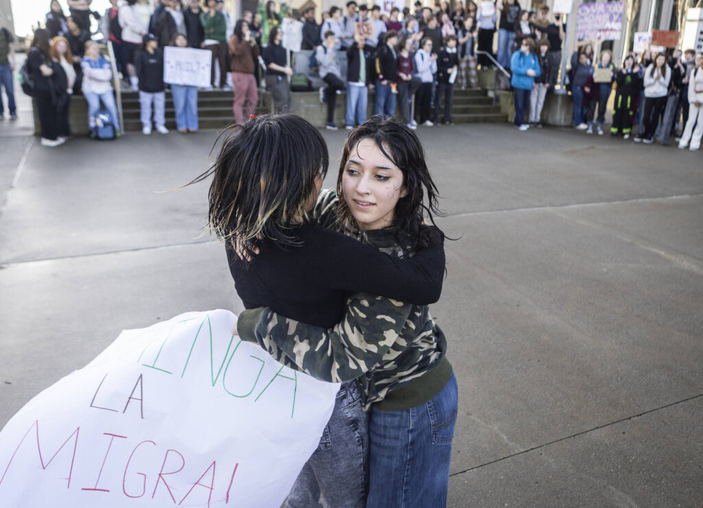 Cynthia Espinoza, right, and Liliana P., left, dance to huapango music during a walkout rally in protest of ICE outside of the Snohomish County Courthouse on Tuesday, Jan. 13, 2026, in Everett, Washington. (Olivia Vanni / The Herald)
