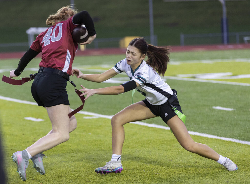 Jackson&rsquo;s Khailiyah Mackey reaches out to grab the flag of Cascade&rsquo;s Caylee Krestel during the game on Wednesday, Jan. 14, 2026 in Everett, Washington. (Olivia Vanni / The Herald)
