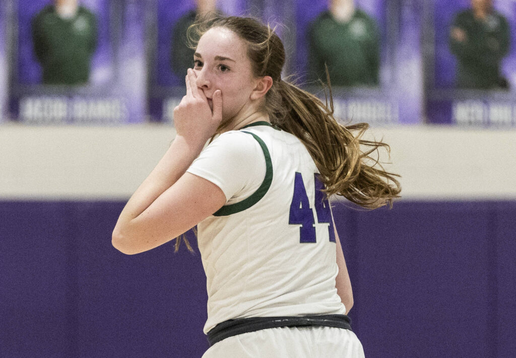 Edmonds-Woodway&rsquo;s Amelia Faber reacts to making a three-point shot during the game against Archbishop Murphy on Tuesday, Jan. 20, 2026 in Edmonds, Washington. (Olivia Vanni / The Herald)
