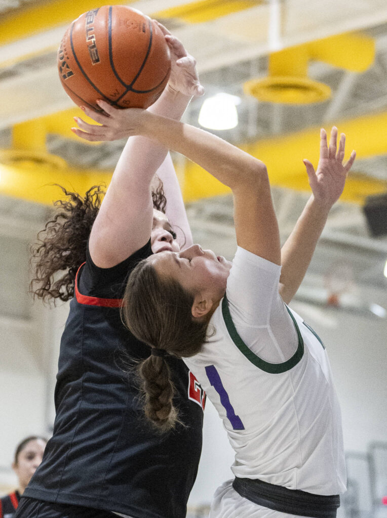 Archbishop Murphy&rsquo;s Celine Wright blocks a shot by Edmonds-Woodway&rsquo;s Jane Hanson during the game on Tuesday, Jan. 20, 2026 in Edmonds, Washington. (Olivia Vanni / The Herald)
