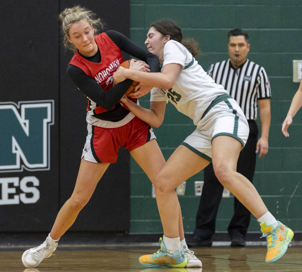 Snohomish&rsquo;s Lola Rotondo grabs the ball from Jackson&rsquo;s Avery Cooke during the game on Thursday, Jan. 22, 2026 in Mill Creek, Washington. (Olivia Vanni / The Herald)

