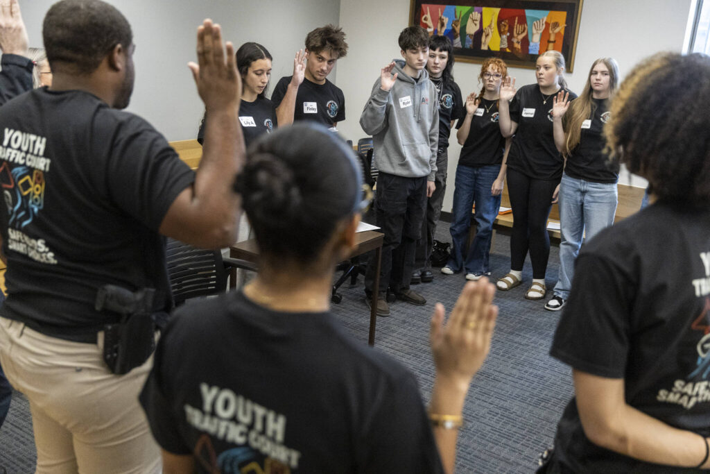 Youth Traffic Court raise their hands to take an oath before the start of the session at the Snohomish County Courthouse on Friday, Jan. 30, 2026 in Everett, Washington. (Olivia Vanni / The Herald)
