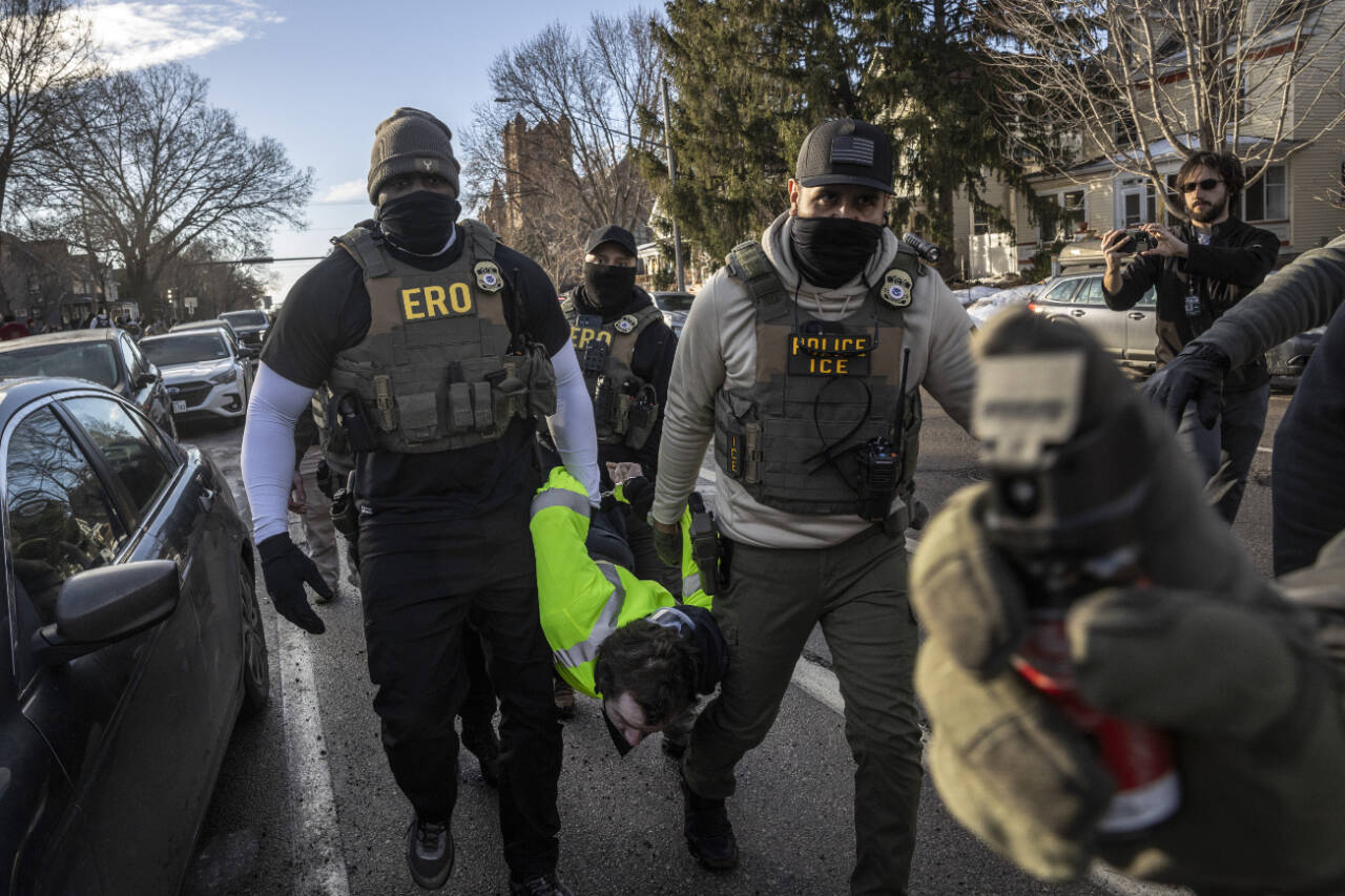 Federal agents arrest a protester during an active immigration enforcement operation in a Minneapolis neighborhood, on Jan. 13. The chief federal judge in Minnesota excoriated Immigration and Customs Enforcement on Wednesday, Jan. 28, saying it had violated nearly 100 court orders stemming from its aggressive crackdown in the state and had disobeyed more judicial directives in January alone than some federal agencies have violated in their entire existence. (David Guttenfelder / The New York Times)