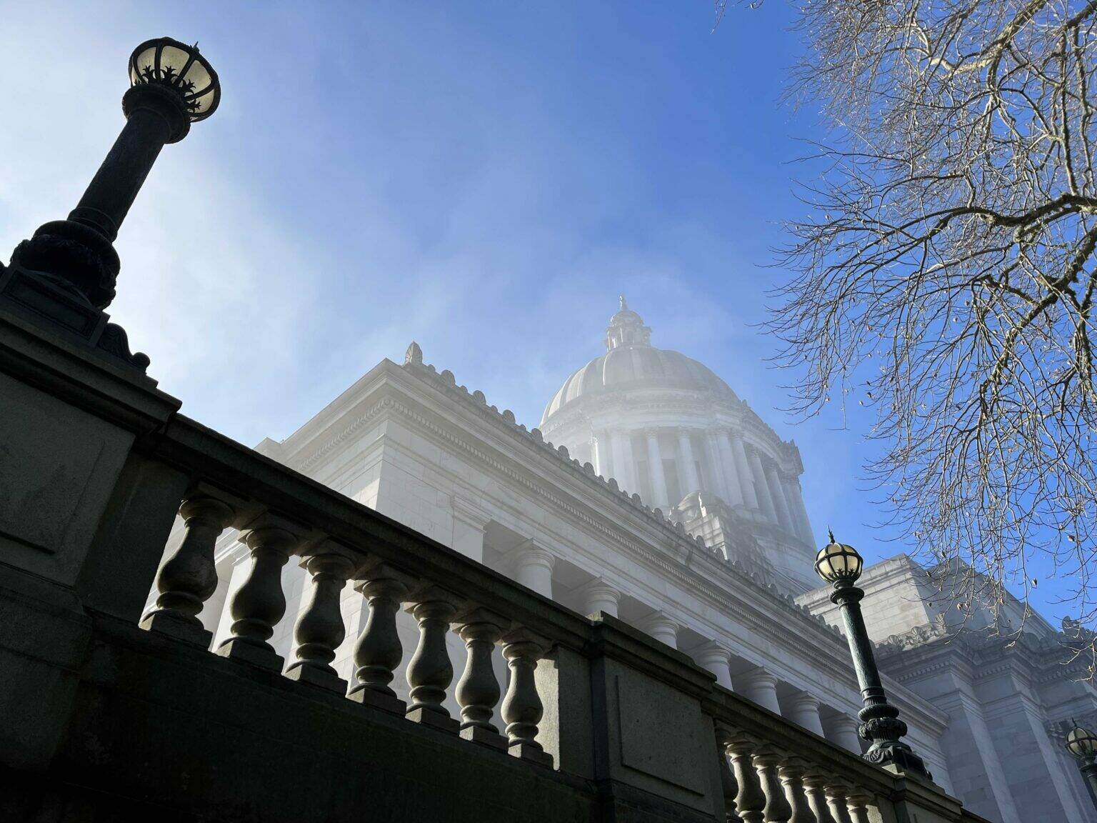 A view of the Washington state Capitol building in Olympia, obscured by a slight mist, Jan. 27, 2025. (Photo by Bill Lucia/Washington State Standard)