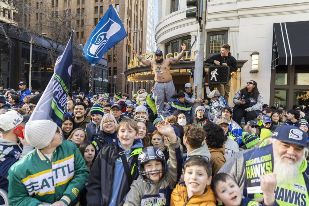 People gather along 4th Avenue before the start of the Seahawks World Champions Parade on Wednesday, Feb. 11, 2026, in Seattle, Washington. (Olivia Vanni / The Herald)
