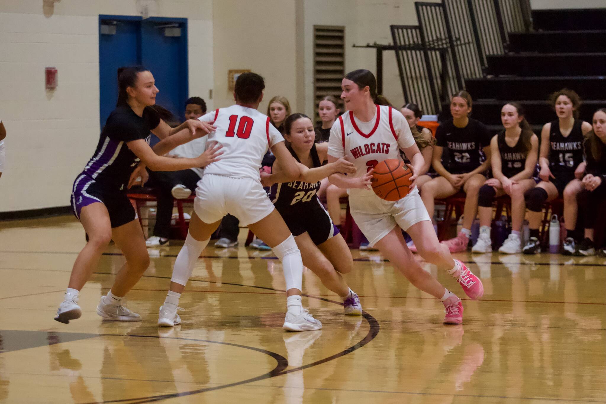 Archbishop Murphy senior Brooke Blachly utilizes a screen from junior Ashley Fletcher (10) to drive into the lane during the Wildcats 76-18 win against the Seahawks in the District 1 2A quarterfinals at Archbishop Murphy High School on Feb. 12, 2026. (Joe Pohoryles/The Herald)