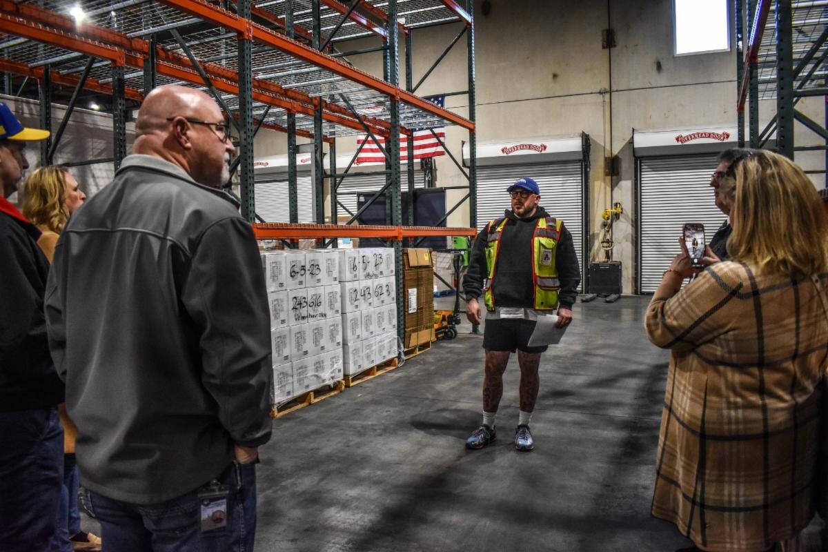 Arlington Mayor Don Vanney tours the citys Volunteers of America Western Washington food distribution center. (Provided photo)