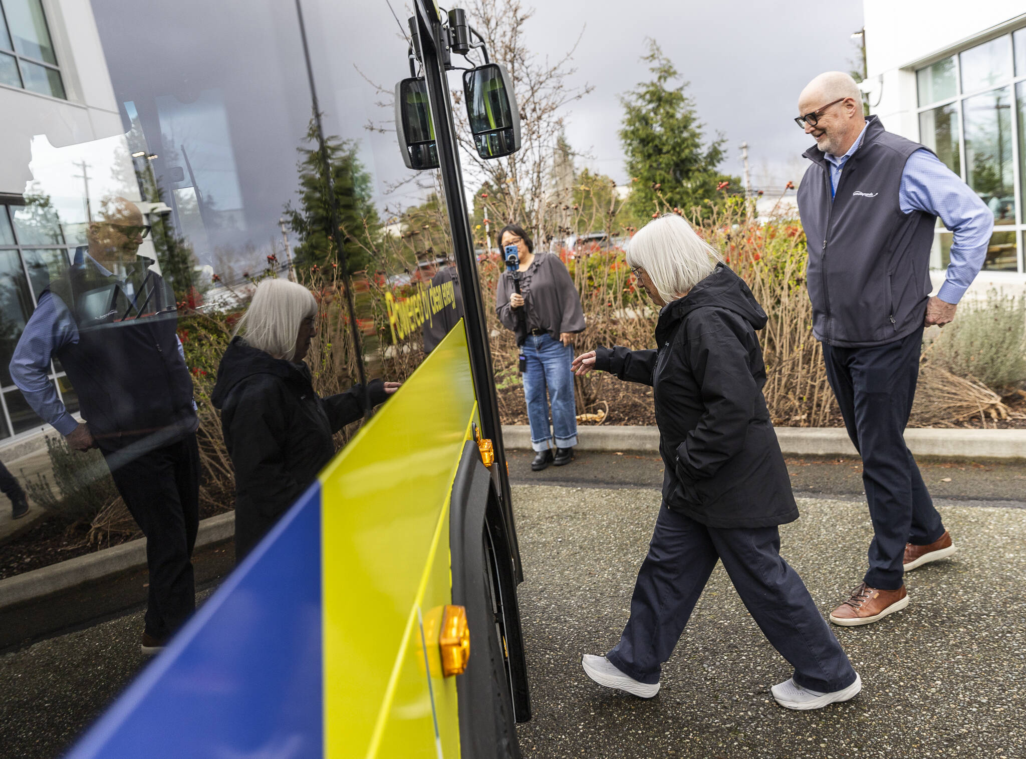 U.S. Sen. Patty Murray and Community Transit CEO Ric Ilgenfritz step onto one of Community Transits electric buses during a tour and roundtable at Community Transits corporate headquarters on Wednesday, Feb. 18, 2026 in Everett, Washington. (Olivia Vanni / The Herald)