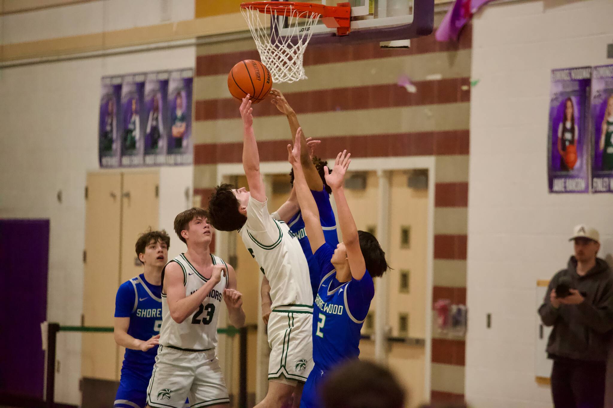 Shorewood senior Nathan Abraha blocks Edmonds-Woodway senior Dre Simonsens attempt under the rim during the Stormrays 42-40 win against the Warriors in the District 1 3A semifinals at Edmonds-Woodway High School on Feb. 17, 2026. (Joe Pohoryles/The Herald)