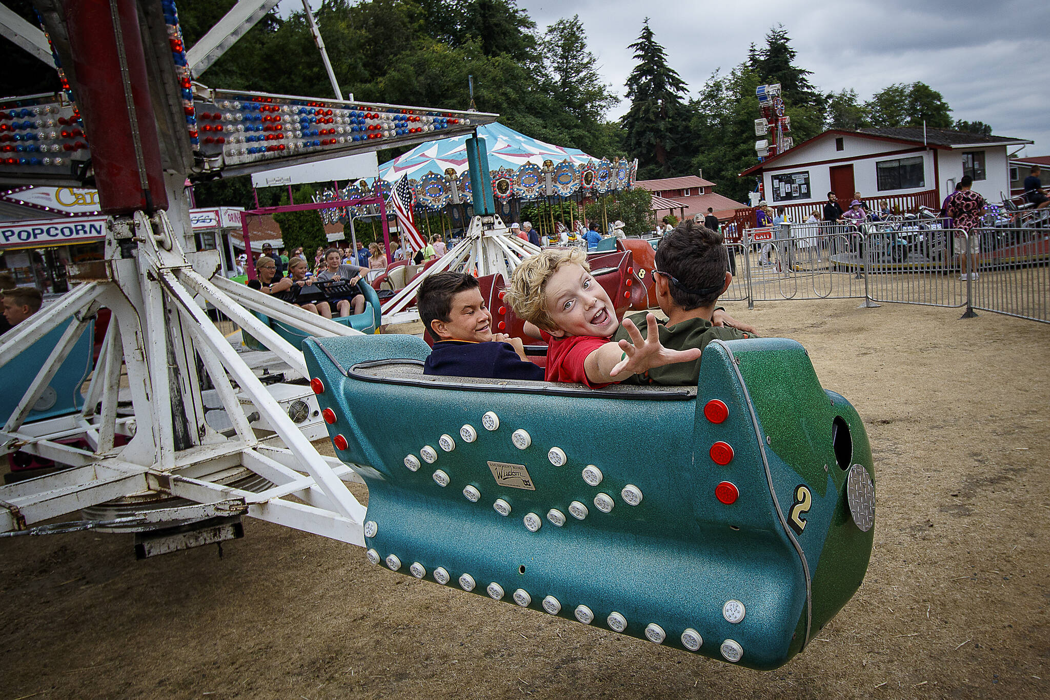 Kids on a carnival ride at the Island County Fair in July 2015. (David Welton)