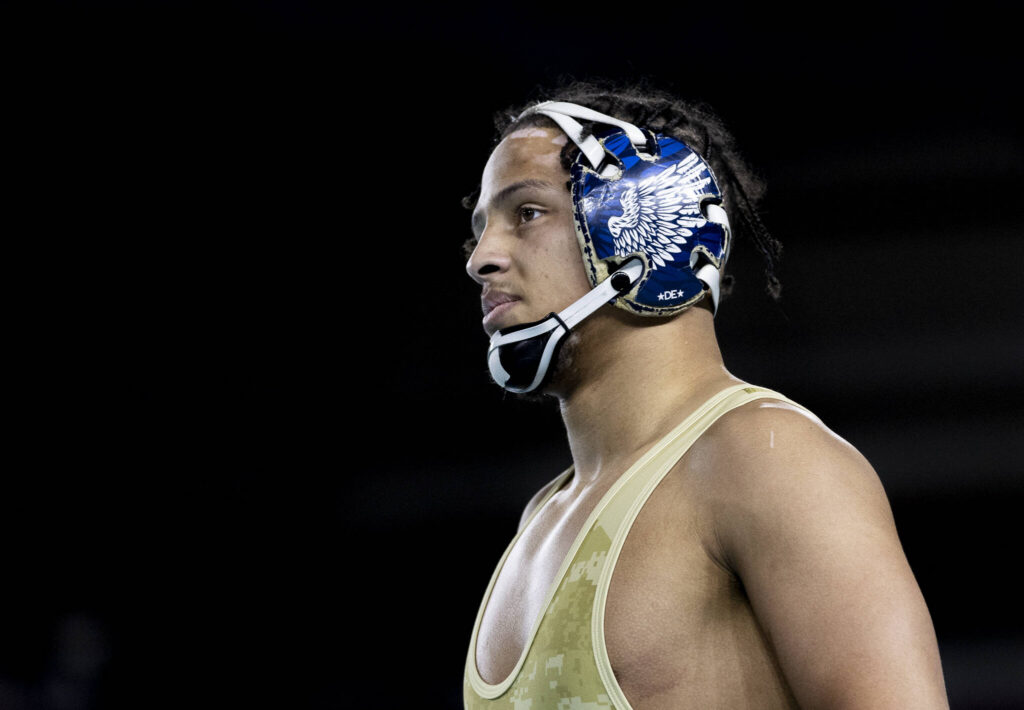 Arlington&rsquo;s Tre Haines looks on during the 4A boys 165-pound championship match at the Mat Classic on Friday, Feb. 20, 2026 in Tacoma, Washington. (Olivia Vanni / The Herald)
