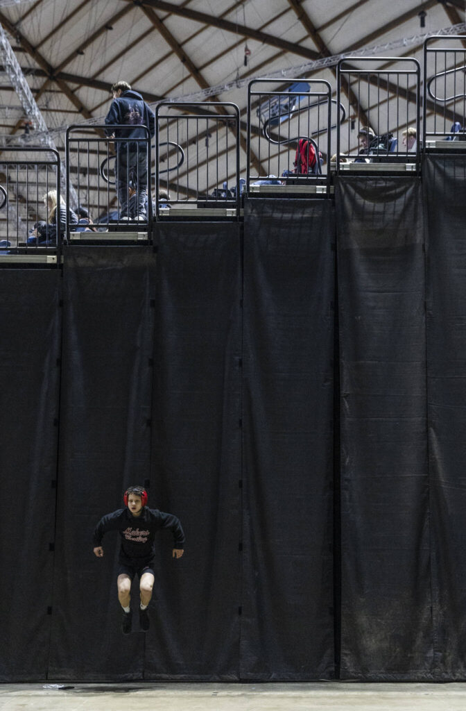 A wrestlers warms up before their match at the Mat Classic on Friday, Feb. 20, 2026 in Tacoma, Washington. (Olivia Vanni / The Herald)
