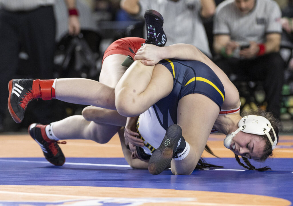Snohomish&rsquo;s Malia Ottow gains control of her opponent&rsquo;s leg during the 3A girls 120-pound championship match at the Mat Classic on Friday, Feb. 20, 2026 in Tacoma, Washington. (Olivia Vanni / The Herald)
