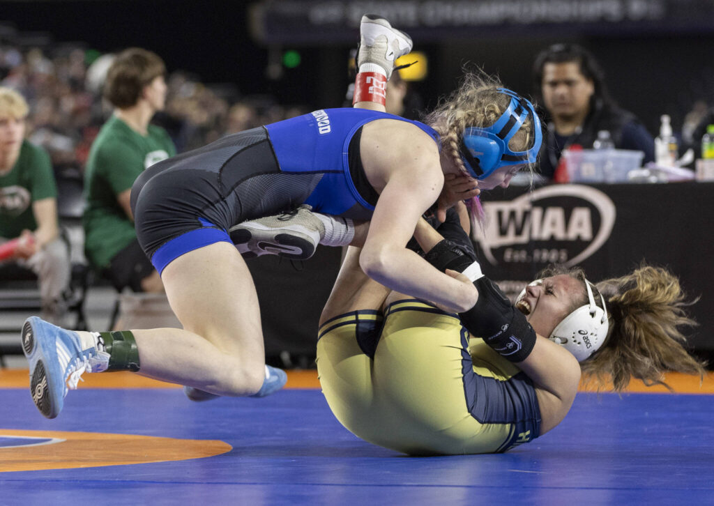Shorewood&rsquo;s Finley Houck pushes her opponent to the ground during the 3A girls 115-pound championship match at the Mat Classic on Friday, Feb. 20, 2026 in Tacoma, Washington. (Olivia Vanni / The Herald)
