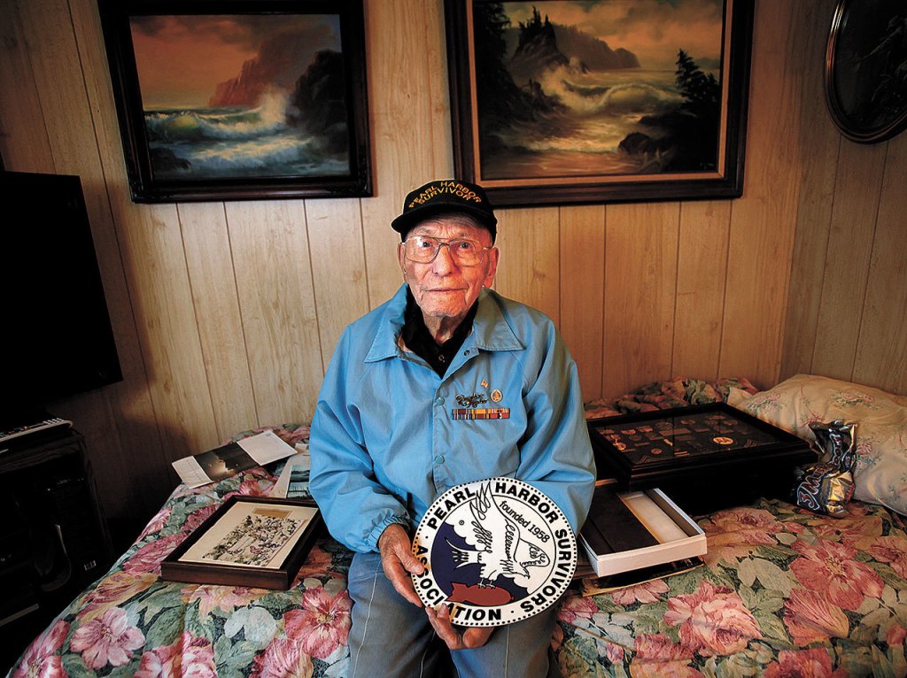 Walter Bailey who passed away May 27 at age 96, is pictured here on December 4, 2013 with a variety of items related to his long history as a Pearl Harbor Survivor. (Dan Bates / The Herald)