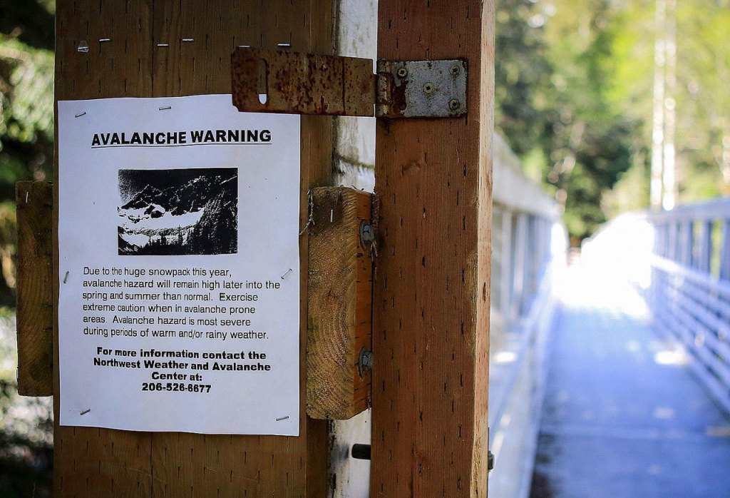 Warning signs dot the trail at the Big Four Ice Caves east of Granite Falls. (Kevin Clark / Herald file)