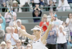 Jana Cepelova of Slovakia celebrates after beating Garbine Muguruza of Spain in their women&rsquo;s singles match on day four of the Wimbledon Tennis Championships in London, Thursday, June 30, 2016. (AP Photo/Ben Curtis)