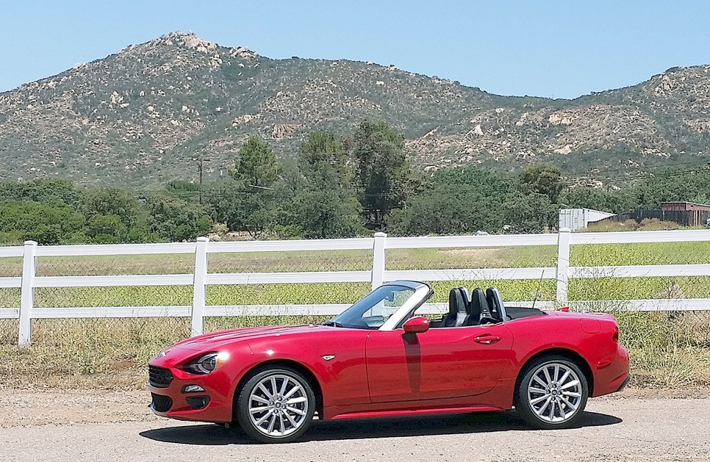 The 2017 Fiat 124 Spider is based on the current Mazda MX-5 Miata but was designed in Turin at Centro Stile. Its turbocharged four-cylinder engine is assembled in Termoli, Italy. (Mary Lowry / For The Herald)
